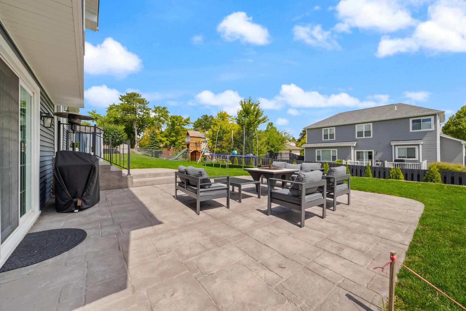 375 Partridge Court Algonquin, IL 60102 - Photo 24 of 27 a view of a patio with dining table and chairs with a patio