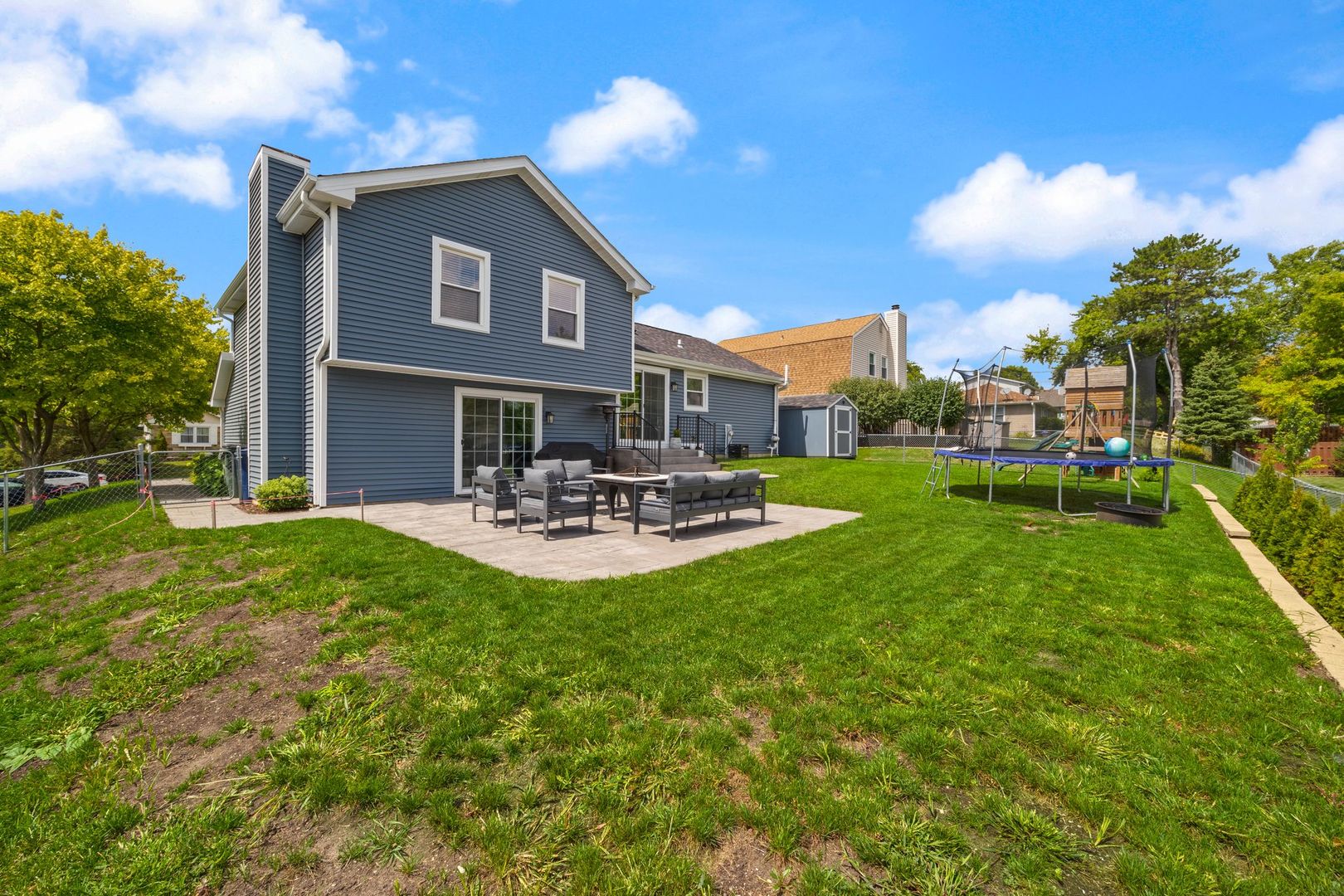 375 Partridge Court Algonquin, IL 60102 - Photo 25 of 27 a front view of a house with patio and garden