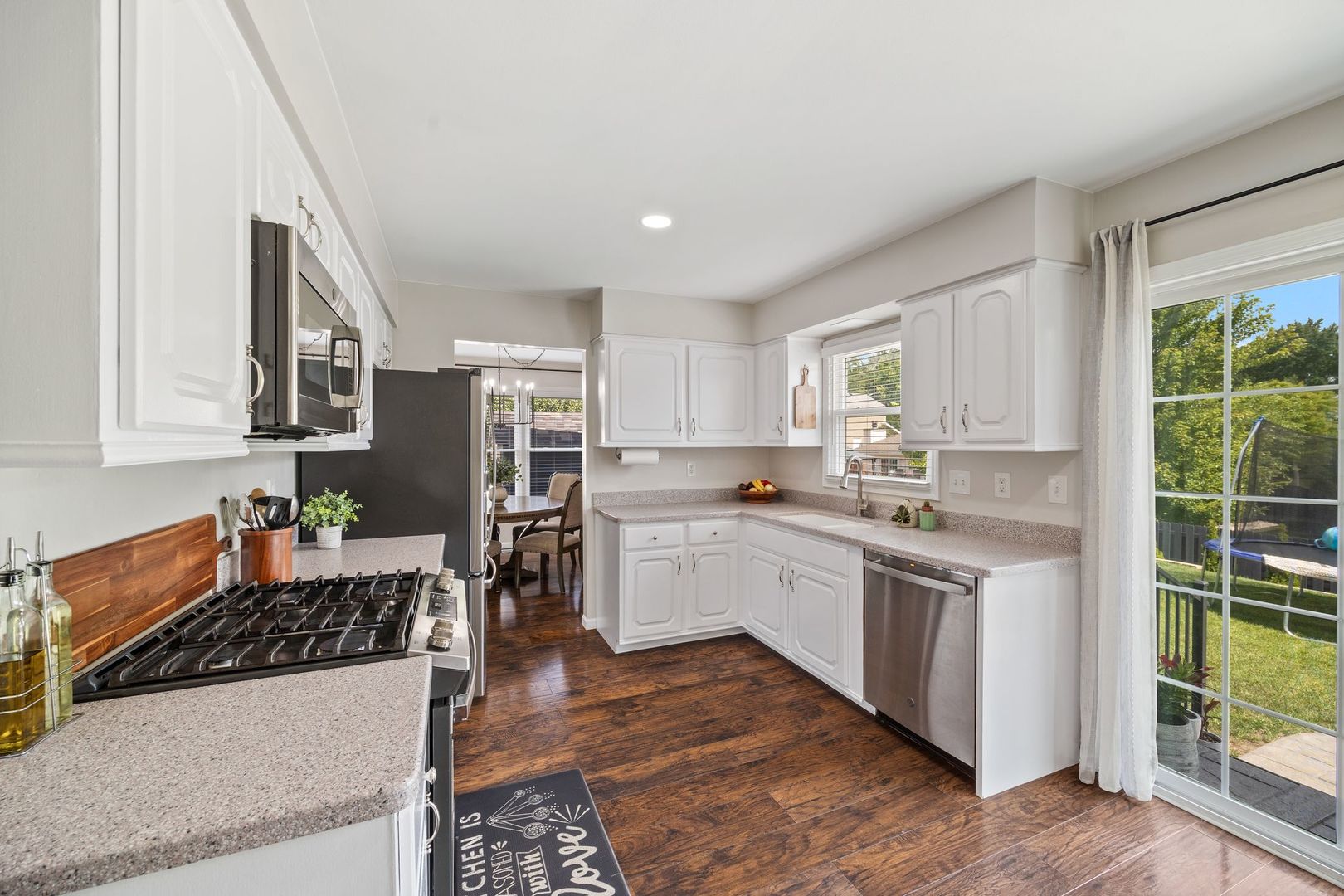 375 Partridge Court Algonquin, IL 60102 - Photo 7 of 27 a kitchen with stainless steel appliances granite countertop a stove a sink dishwasher and a refrigerator