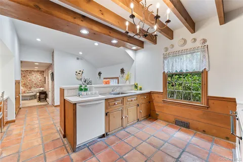 a kitchen with stainless steel appliances granite countertop a sink and cabinets