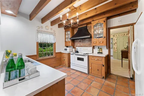 a kitchen with stainless steel appliances granite countertop a sink and a stove
