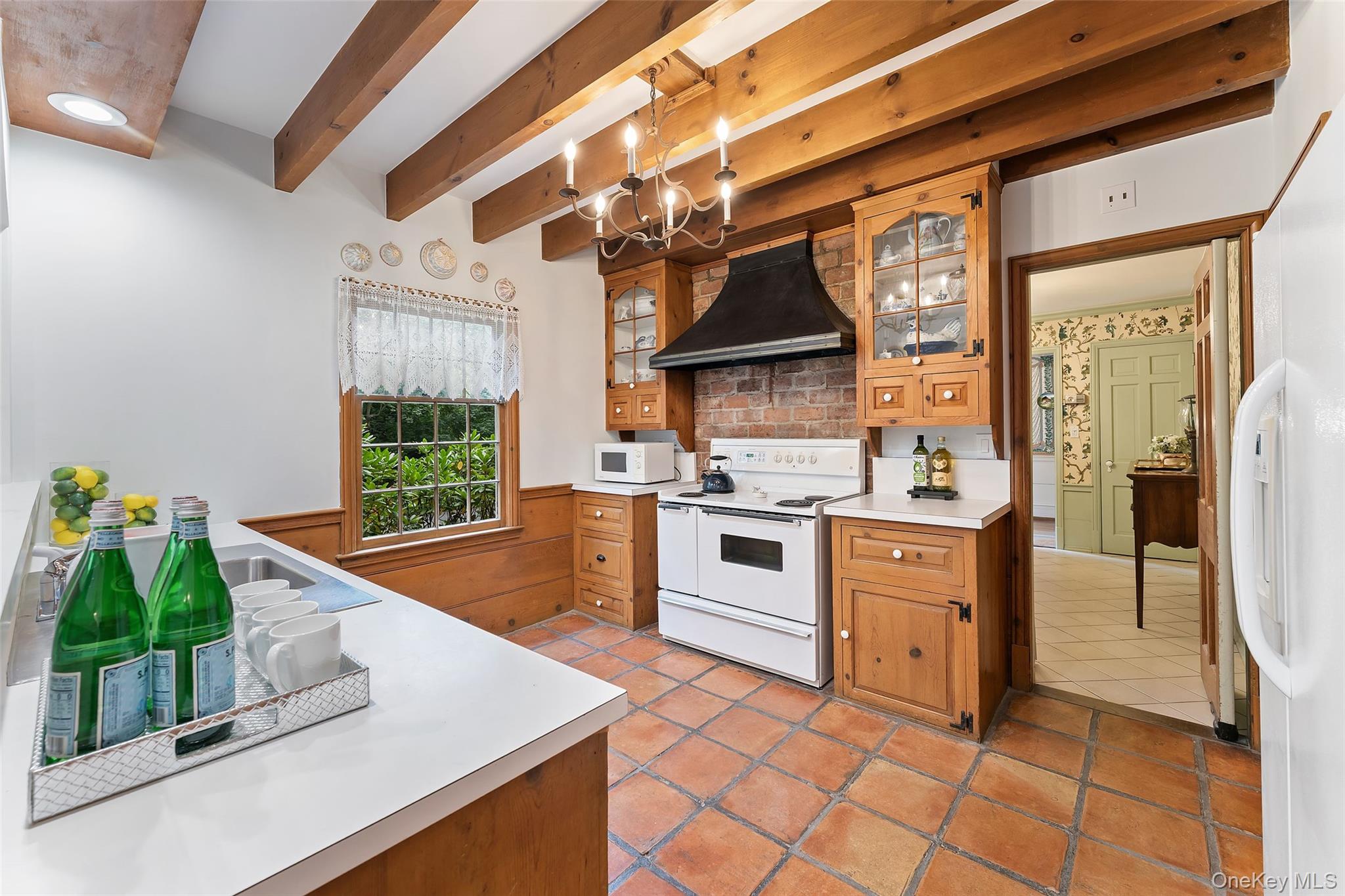 126 Penn Road Scarsdale, NY 10583 - Photo 10 of 34 a kitchen with stainless steel appliances granite countertop a sink and a stove