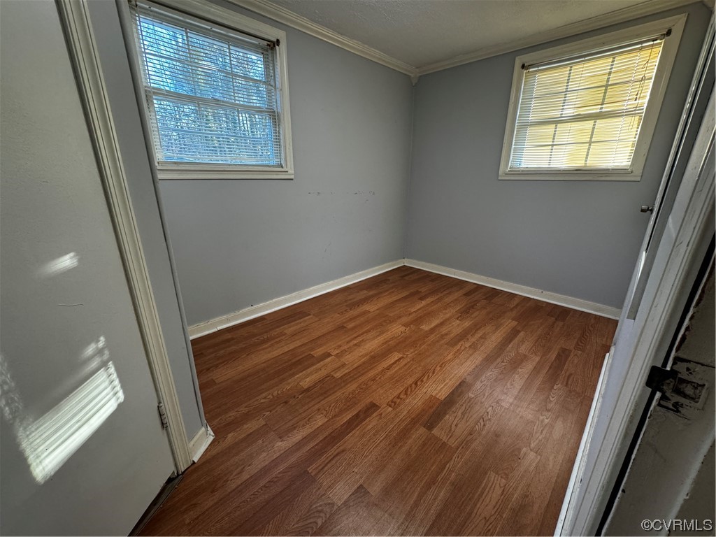 17096 Courtney Road Hanover, VA 23069 - Photo 13 of 27 a view of an empty room with wooden floor and a window