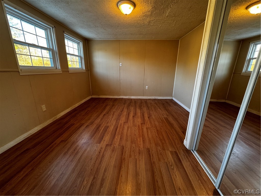 17096 Courtney Road Hanover, VA 23069 - Photo 14 of 27 a view of an empty room with wooden floor and a window