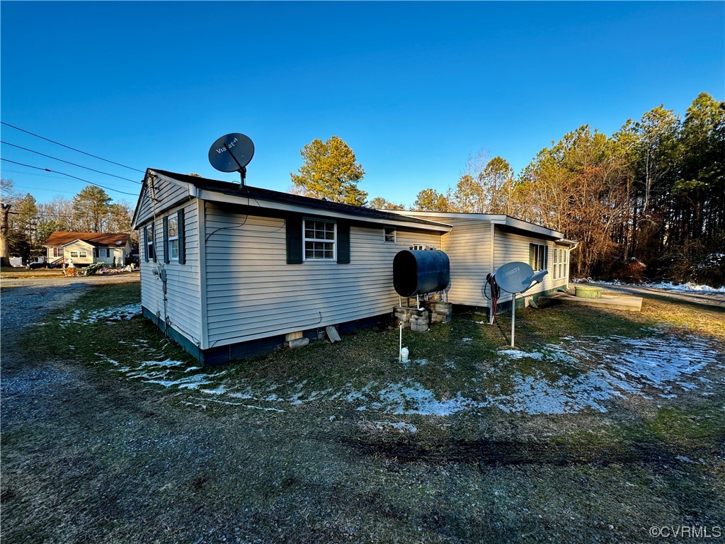 17096 Courtney Road Hanover, VA 23069 - Photo 21 of 27 a view of a back yard of the house