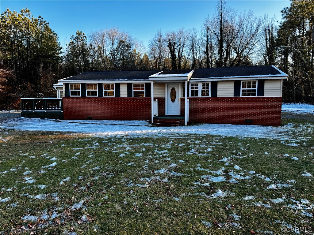 17096 Courtney Road Hanover, VA 23069 - Photo 27 of 27 a front view of house with yard and trees in the background