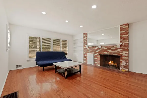 a bathroom with a granite countertop sink mirror and double