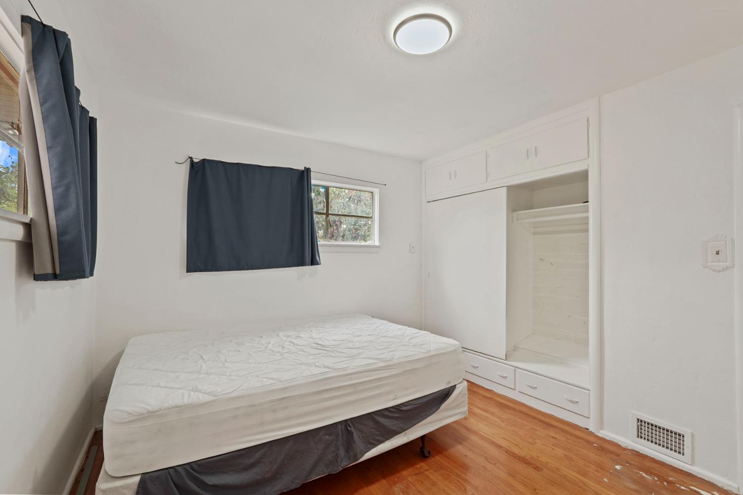 14371 Race Track Road Walnut Grove, CA 95690 - Photo 48 of 88 a bedroom with a bed and a painting on the wall