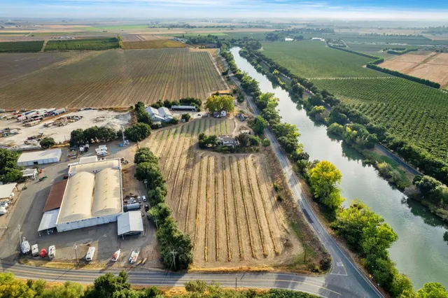 an aerial view of a house with a lake view