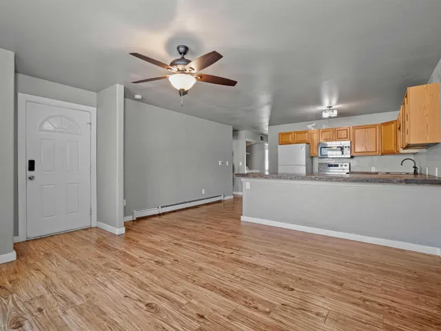 a view of a livingroom with wooden floor