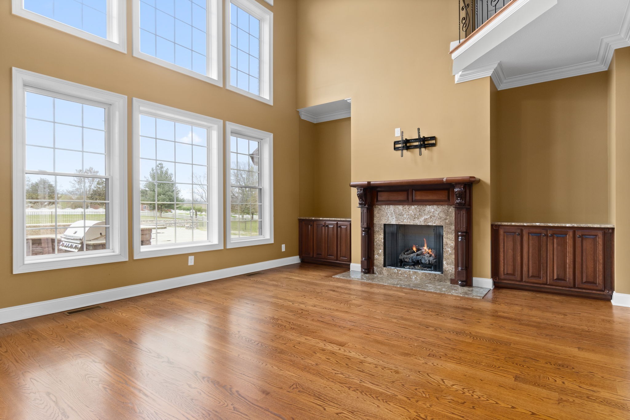 4591 Sango Road Clarksville, TN 37043 - Photo 11 of 70 a view of an empty room with glass door and wooden floor