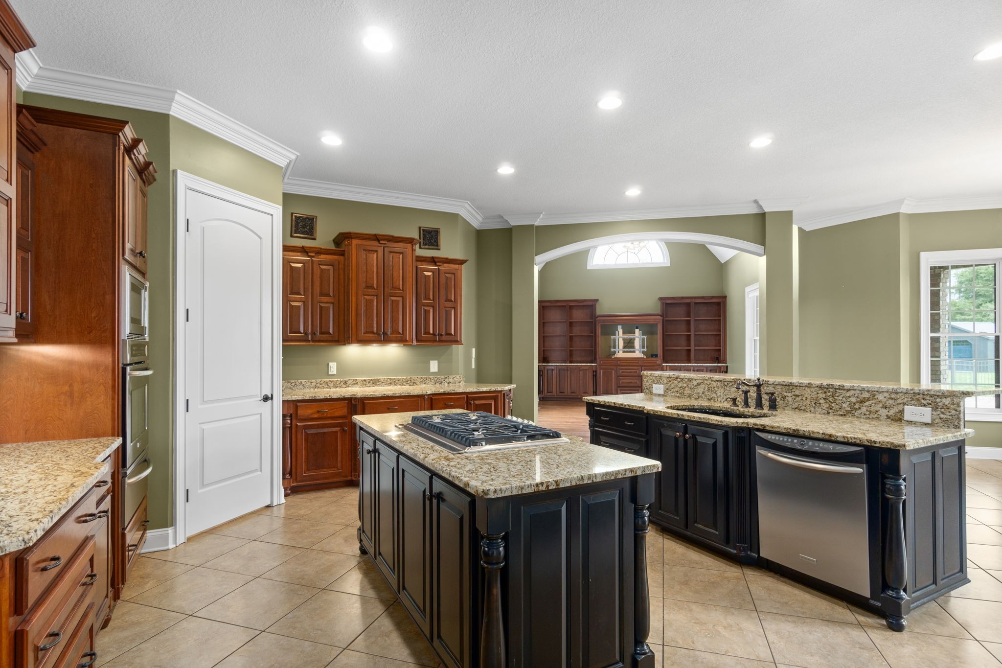 4591 Sango Road Clarksville, TN 37043 - Photo 19 of 70 a kitchen with granite countertop stainless steel appliances lots of counter top space