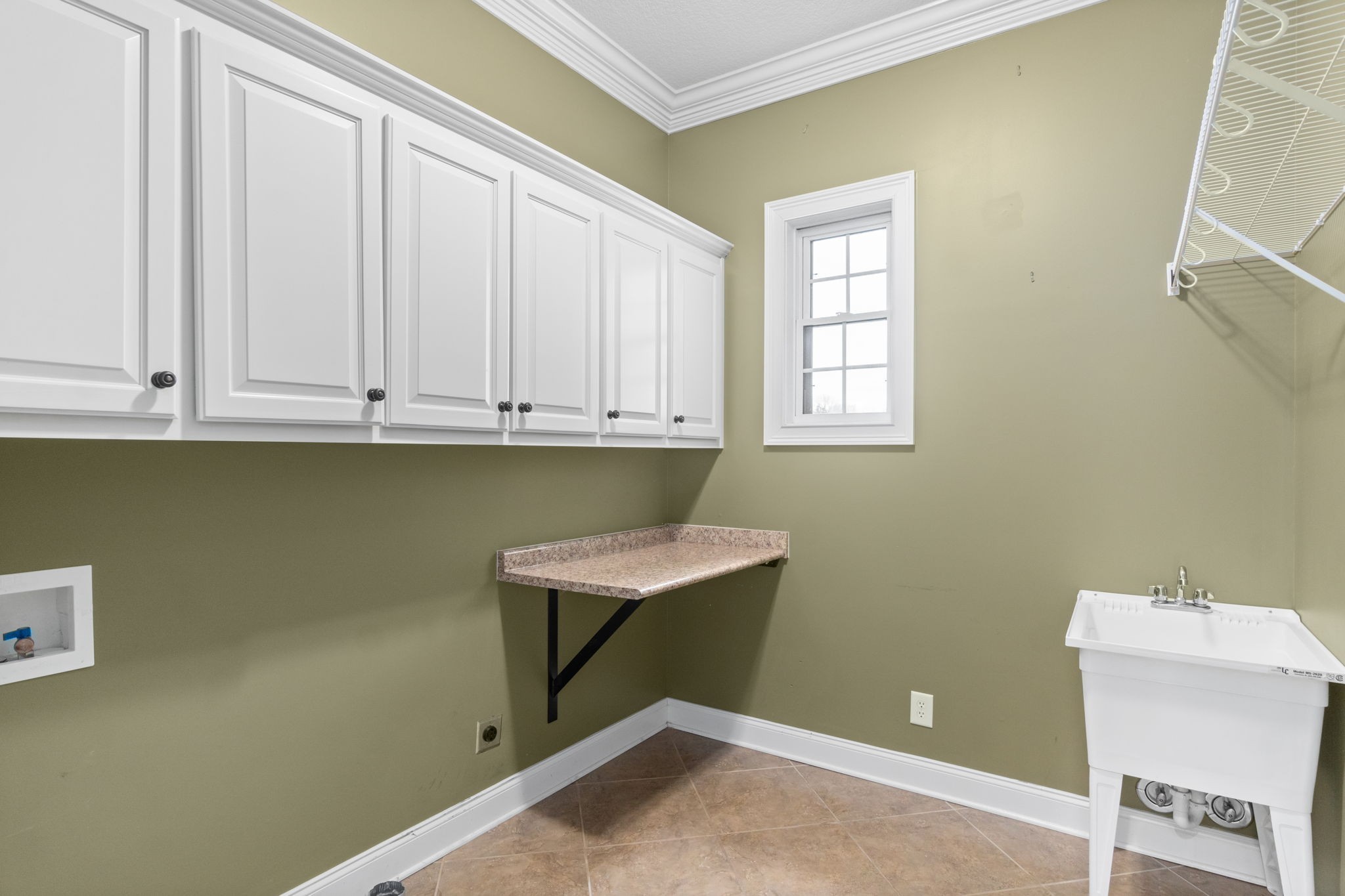 4591 Sango Road Clarksville, TN 37043 - Photo 25 of 70 a room with a cabinets and a window