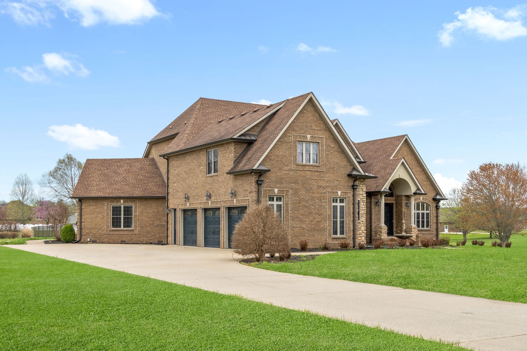 4591 Sango Road Clarksville, TN 37043 - Photo 3 of 70 a front view of a house with a garden