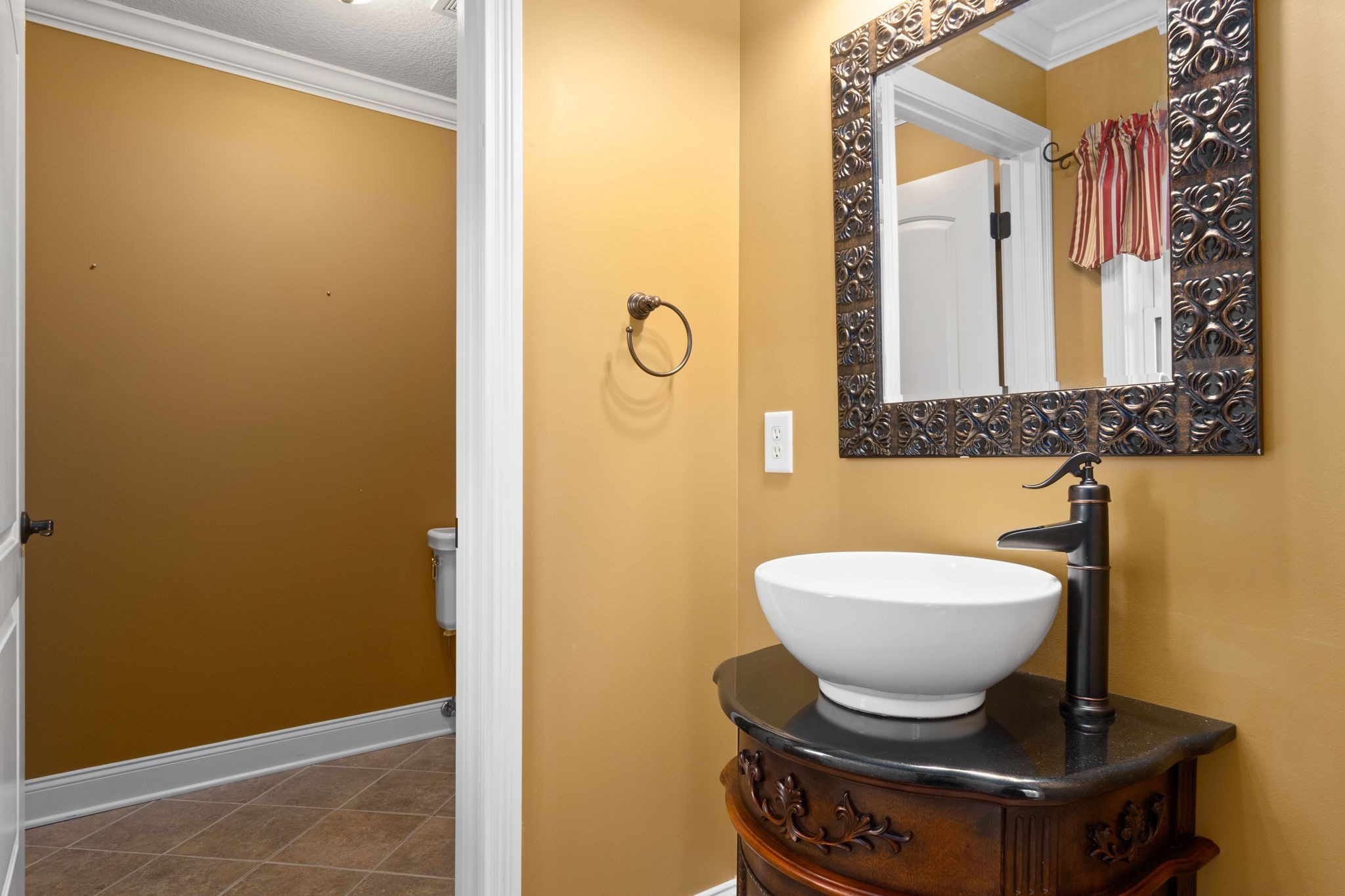 4591 Sango Road Clarksville, TN 37043 - Photo 40 of 70 a bathroom with a toilet a sink and mirror