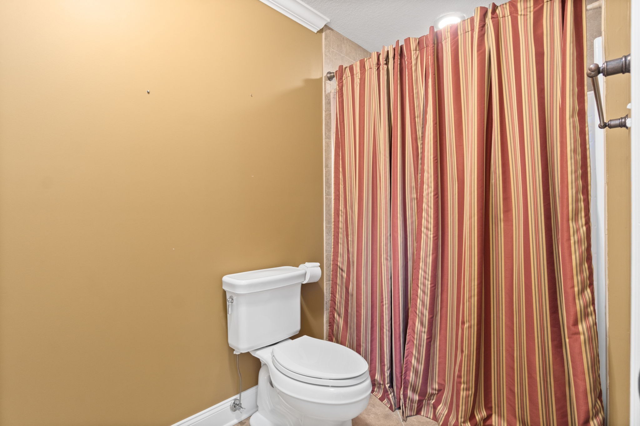 4591 Sango Road Clarksville, TN 37043 - Photo 41 of 70 a white toilet sitting next to a small yard