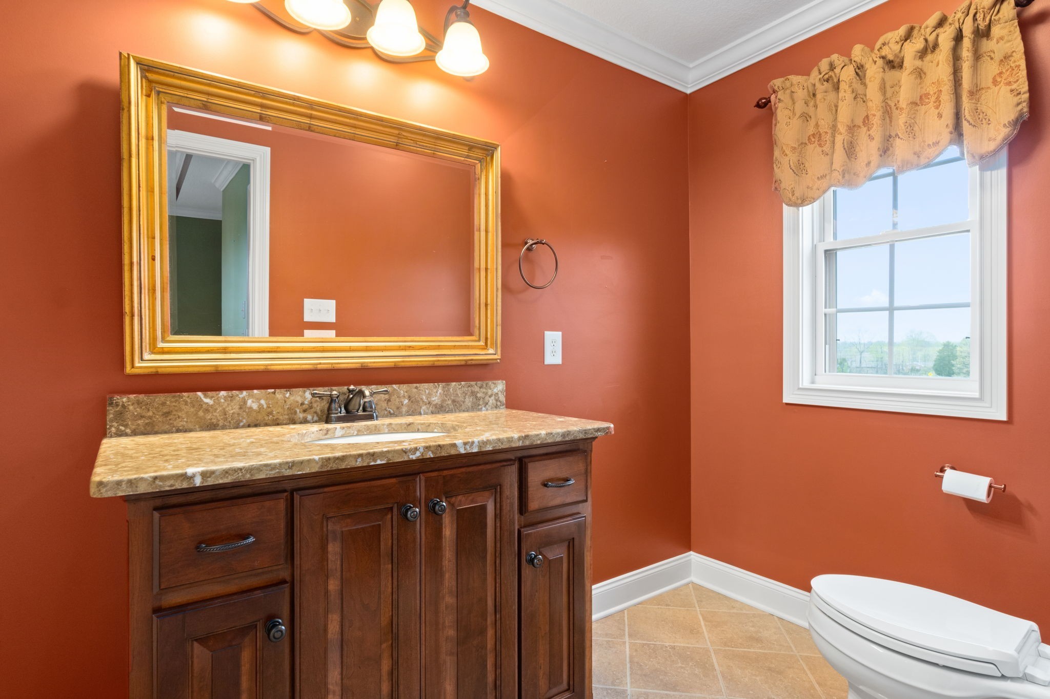 4591 Sango Road Clarksville, TN 37043 - Photo 44 of 70 a bathroom with a sink a toilet and a mirror