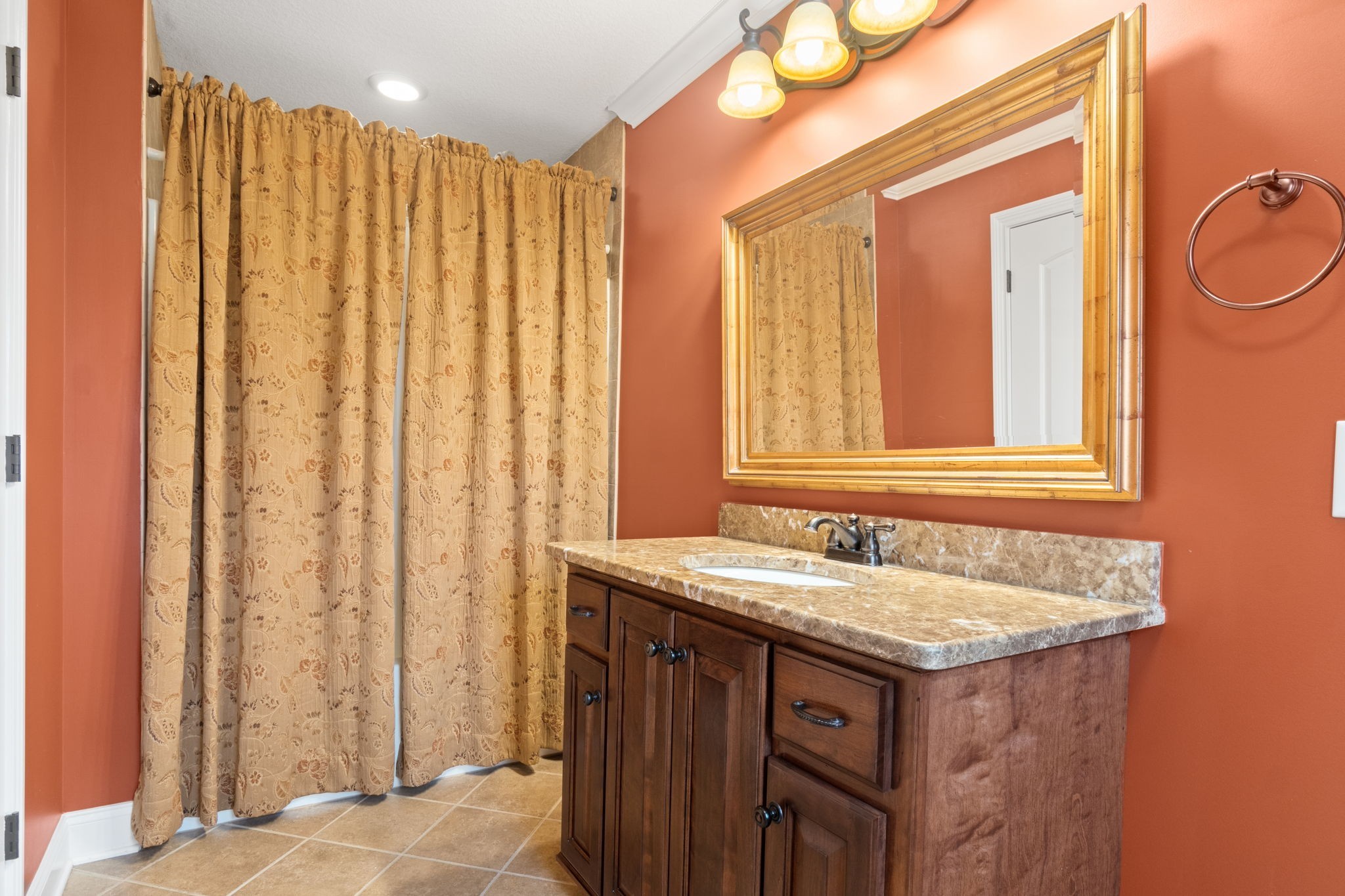 4591 Sango Road Clarksville, TN 37043 - Photo 45 of 70 a bathroom with a granite countertop sink and a mirror