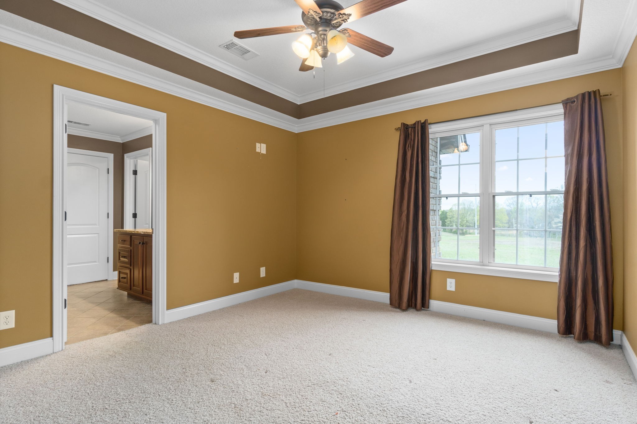 4591 Sango Road Clarksville, TN 37043 - Photo 46 of 70 an empty room that has a window and a ceiling fan