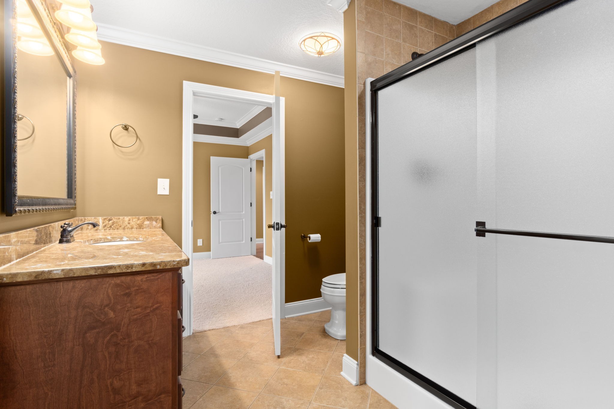 4591 Sango Road Clarksville, TN 37043 - Photo 49 of 70 a en suite bathroom with a granite countertop sink and a mirror