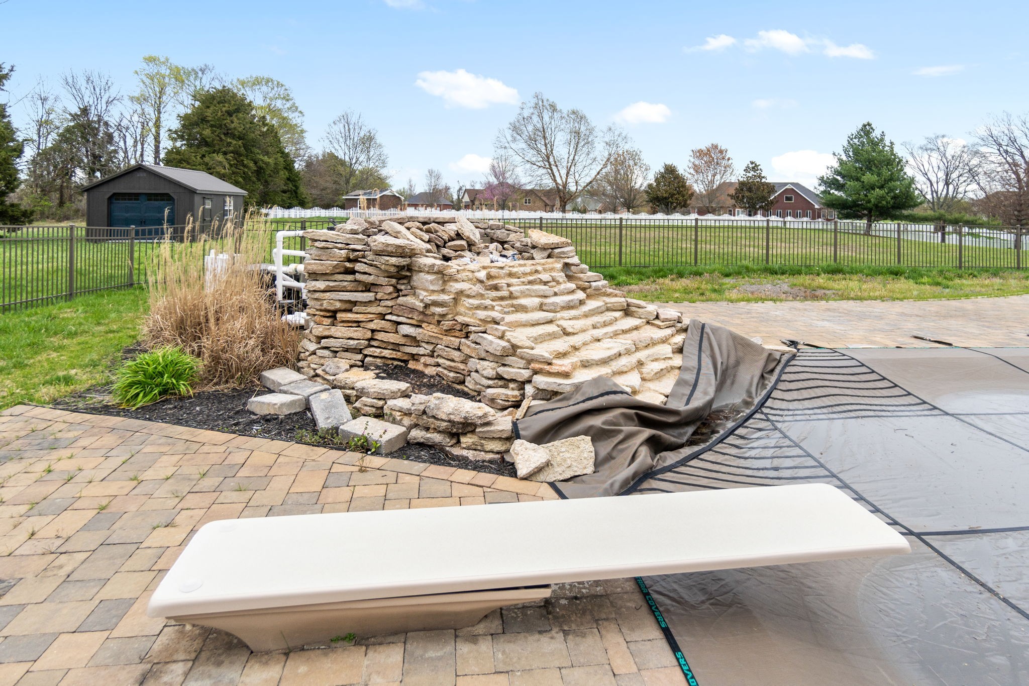 4591 Sango Road Clarksville, TN 37043 - Photo 58 of 70 a view of a garden with a bench in front of the house
