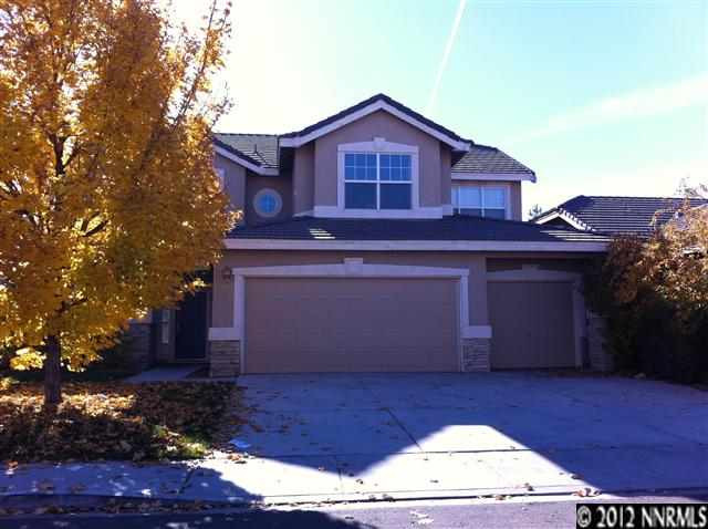9555 Apache Rose Drive Reno, NV 89521 - Photo 1 of 1 a view of a house with a yard