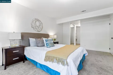 a en suite bathroom with double vanity sinks and a mirror