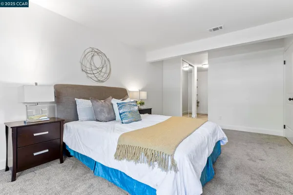 a en suite bathroom with double vanity sinks and a mirror