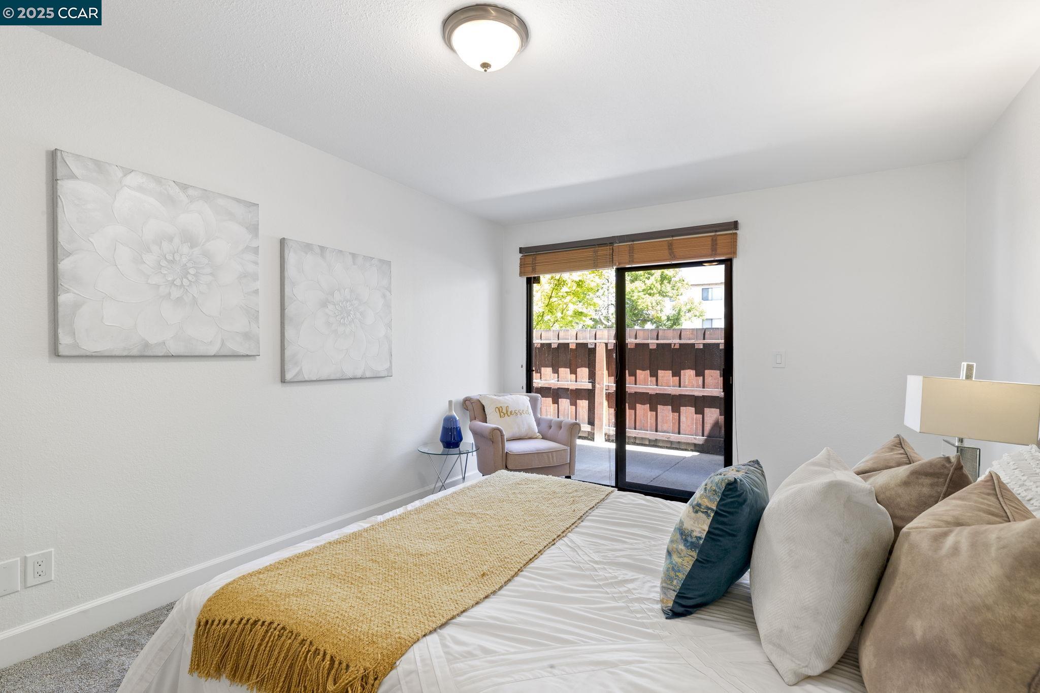 5050 Valley Crest Drive, Unit 63 Concord, CA 94521 - Photo 24 of 55 a bedroom with a bed and a window