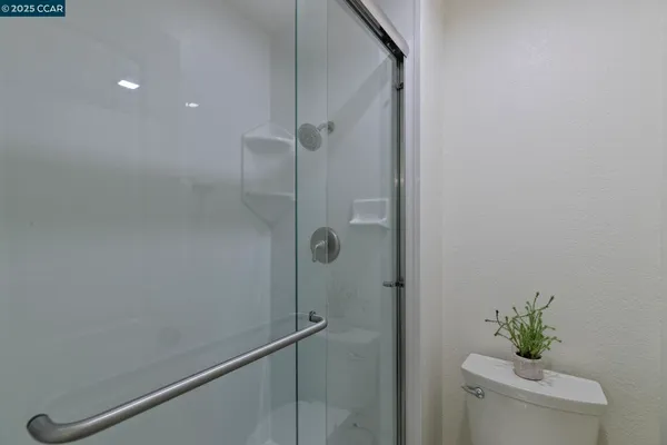 a living room with furniture and a lamp