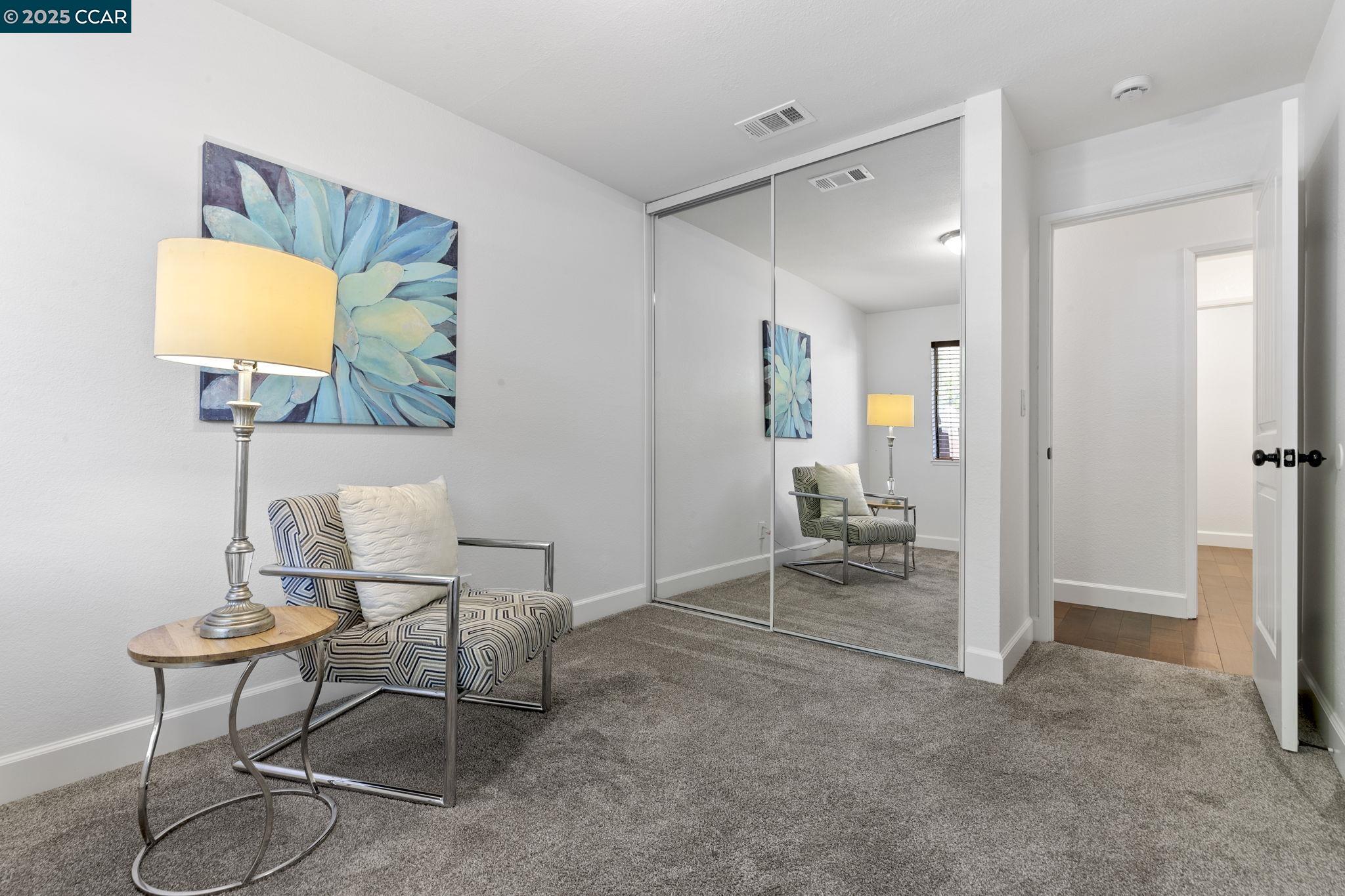 5050 Valley Crest Drive, Unit 63 Concord, CA 94521 - Photo 31 of 55 a living room with furniture and a lamp