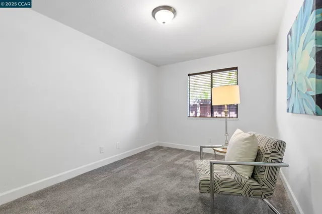 a bathroom with a granite countertop sink toilet a mirror and bathtub