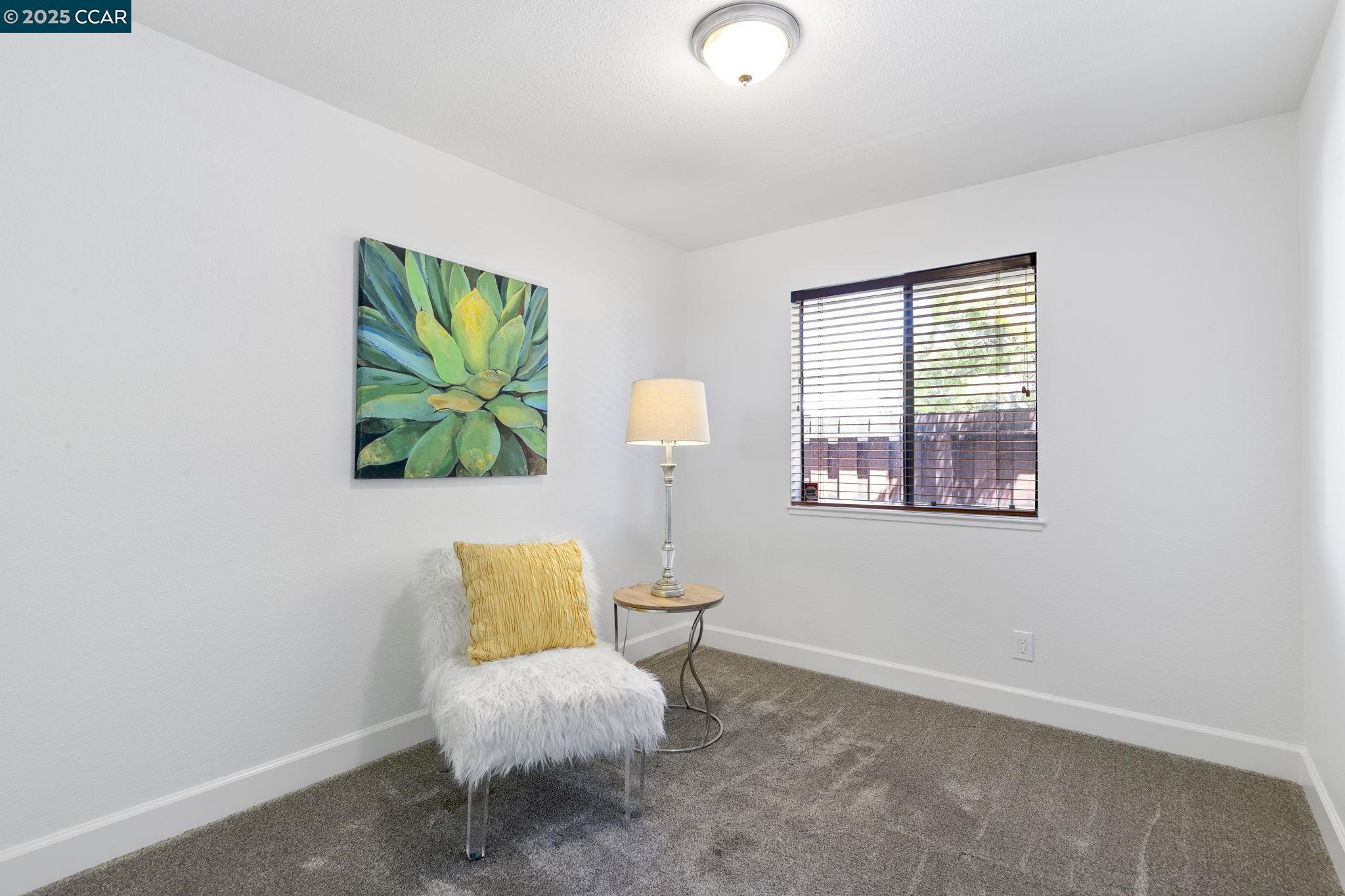 5050 Valley Crest Drive, Unit 63 Concord, CA 94521 - Photo 33 of 55 a living room with furniture and a window