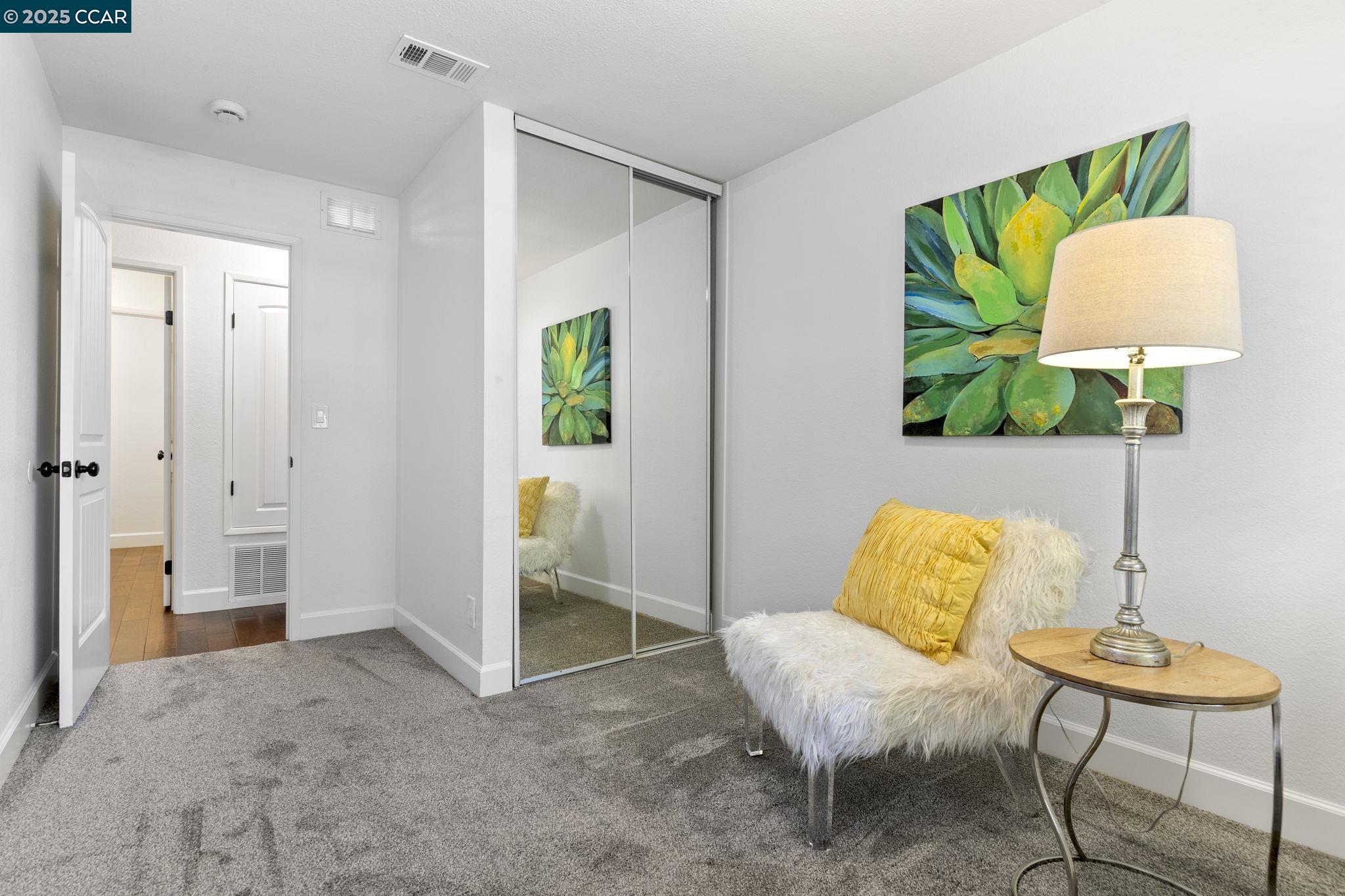 5050 Valley Crest Drive, Unit 63 Concord, CA 94521 - Photo 34 of 55 a living room with furniture and a lamp