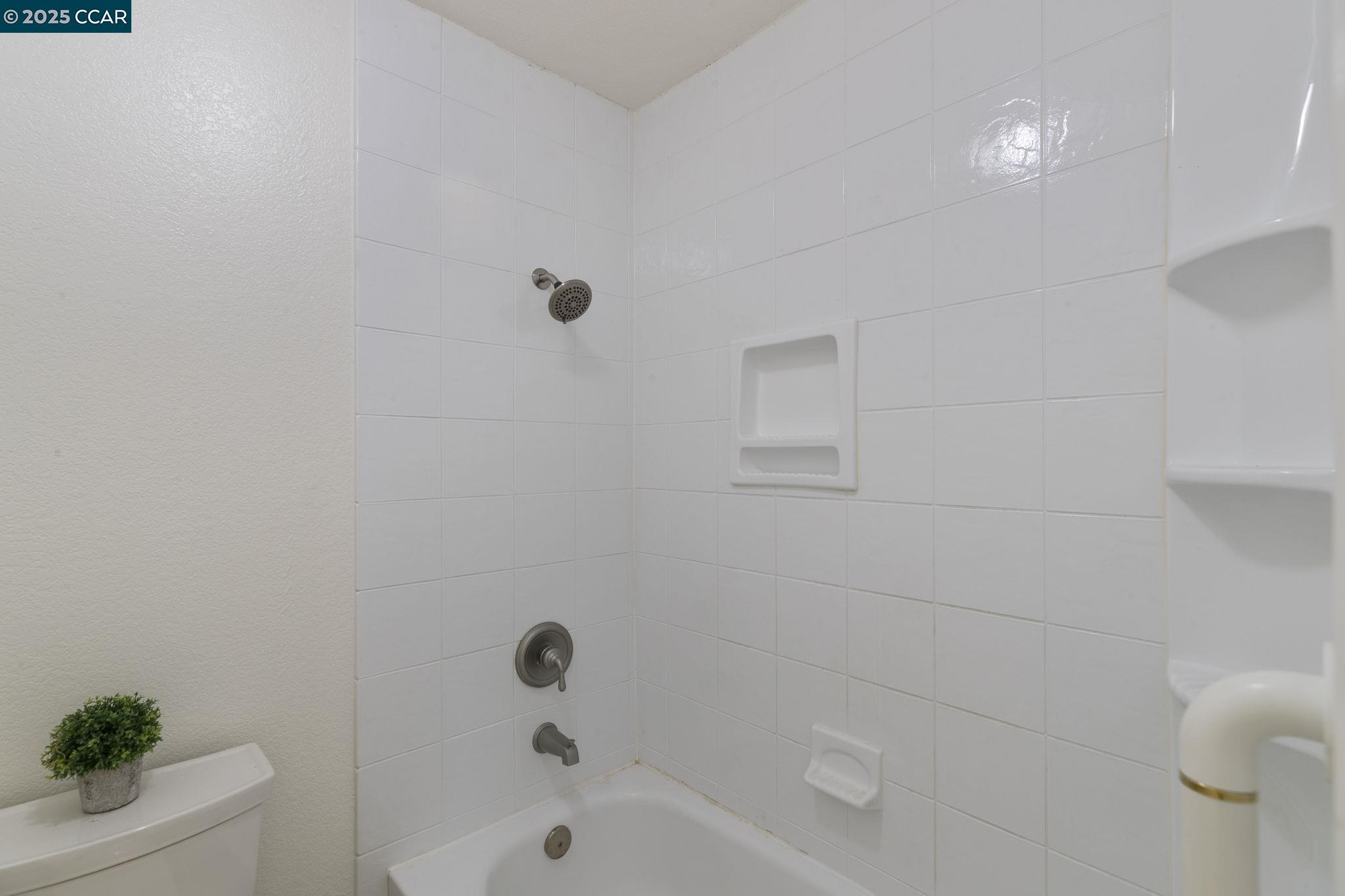 5050 Valley Crest Drive, Unit 63 Concord, CA 94521 - Photo 37 of 55 a bathroom with a bathtub