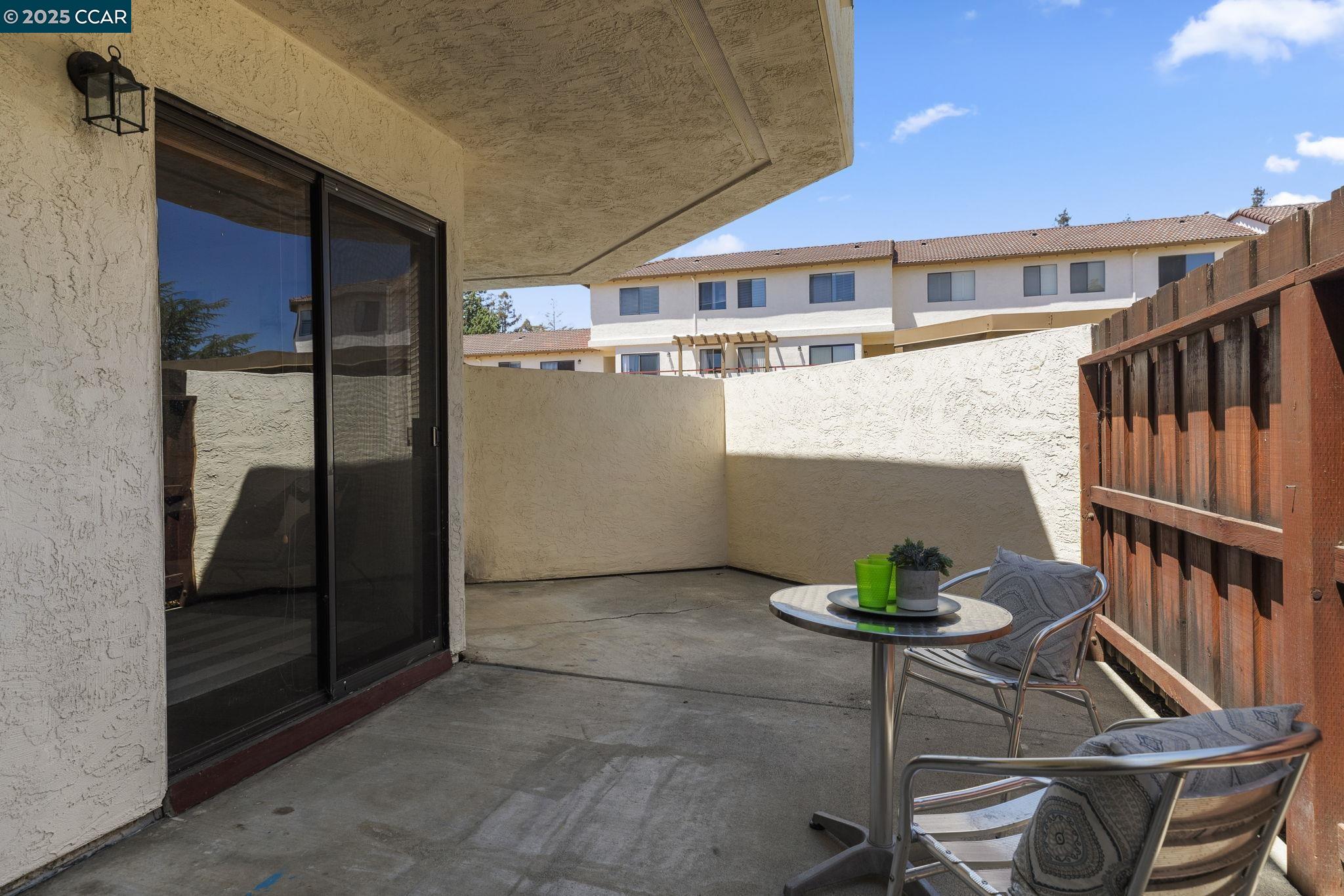5050 Valley Crest Drive, Unit 63 Concord, CA 94521 - Photo 42 of 55 a view of a chairs and table in a patio