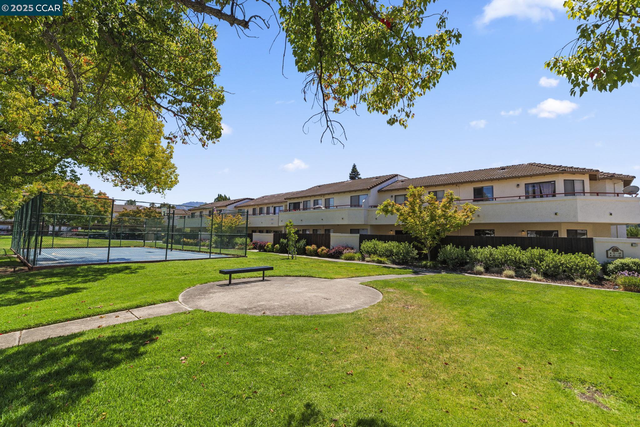 5050 Valley Crest Drive, Unit 63 Concord, CA 94521 - Photo 49 of 55 a view of a house with a big yard and potted plants