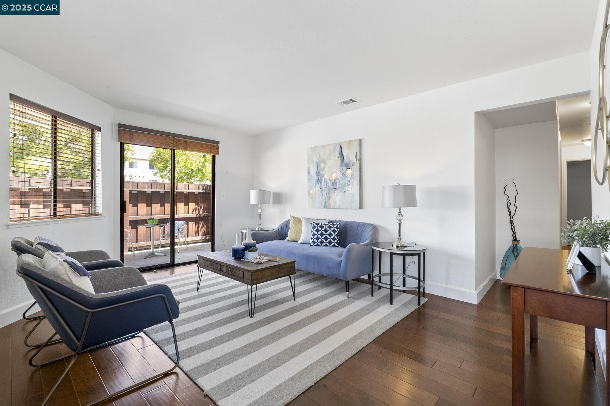 5050 Valley Crest Drive, Unit 63 Concord, CA 94521 - Photo 5 of 55 a living room with furniture and a large window
