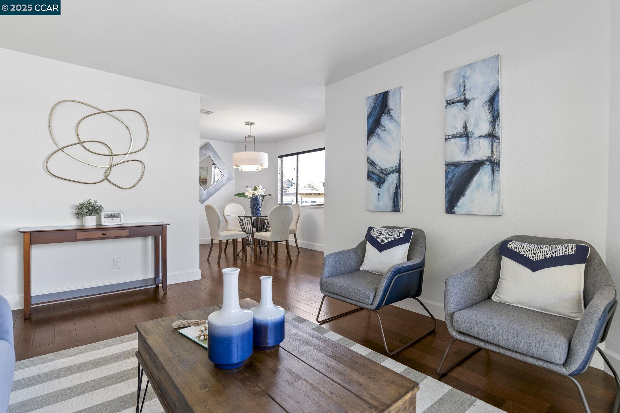 5050 Valley Crest Drive, Unit 63 Concord, CA 94521 - Photo 9 of 55 a living room with furniture and a wooden floor