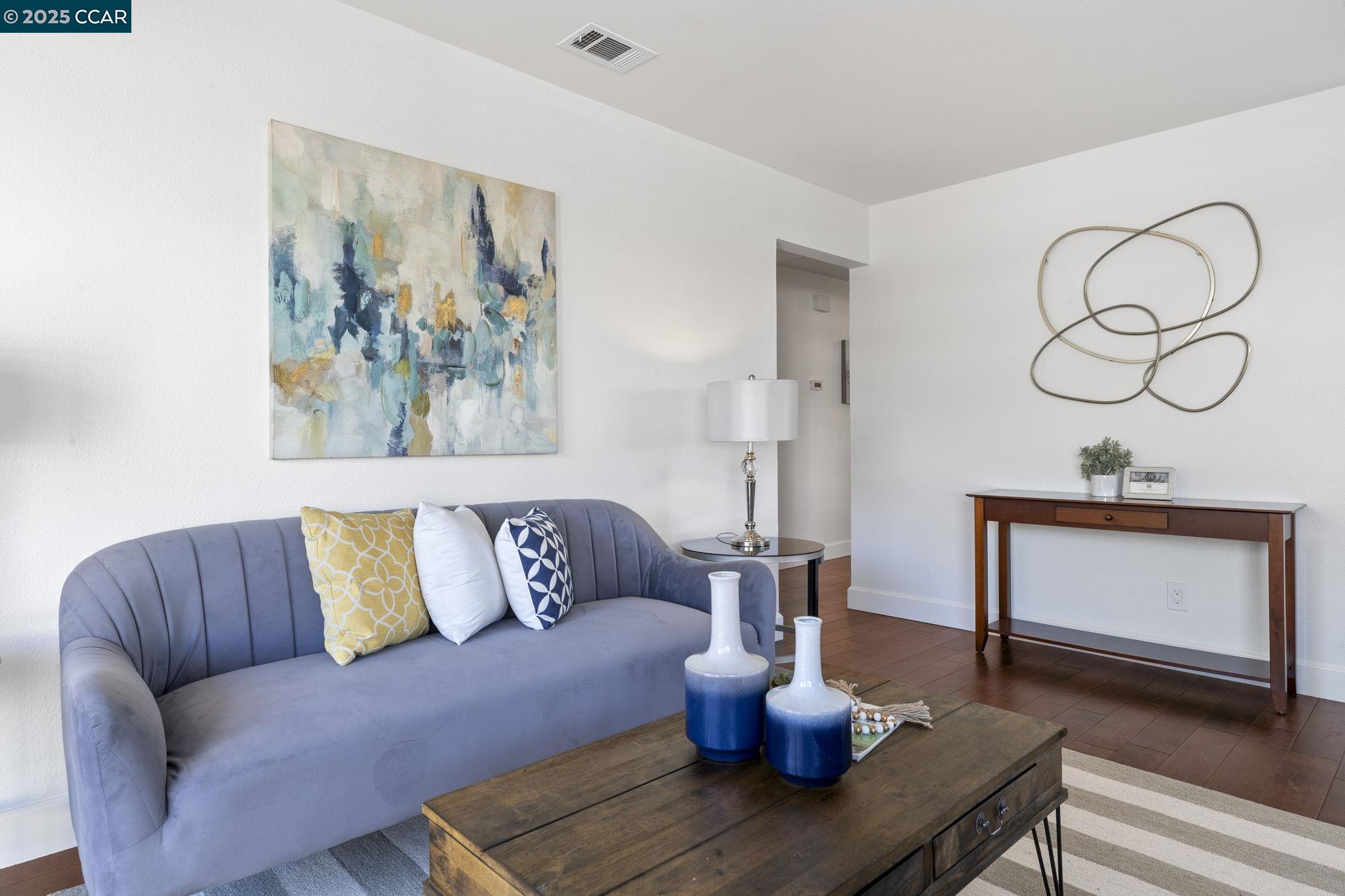 5050 Valley Crest Drive, Unit 63 Concord, CA 94521 - Photo 10 of 55 a living room with furniture and wooden floor