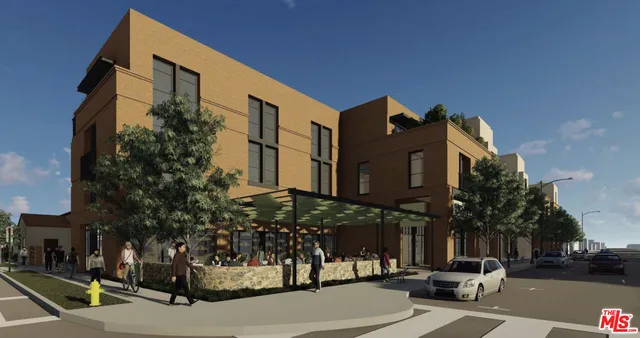 a city street lined with buildings and cars