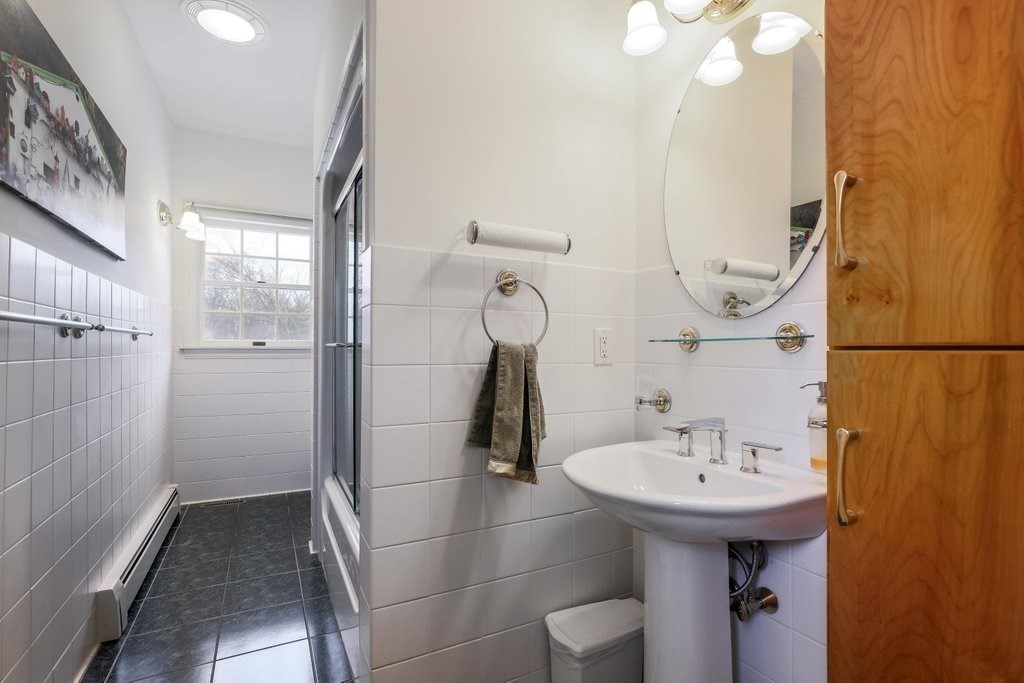 16 Steel Road Hopedale, MA 01747 - Photo 15 of 42 a bathroom with a sink and mirror