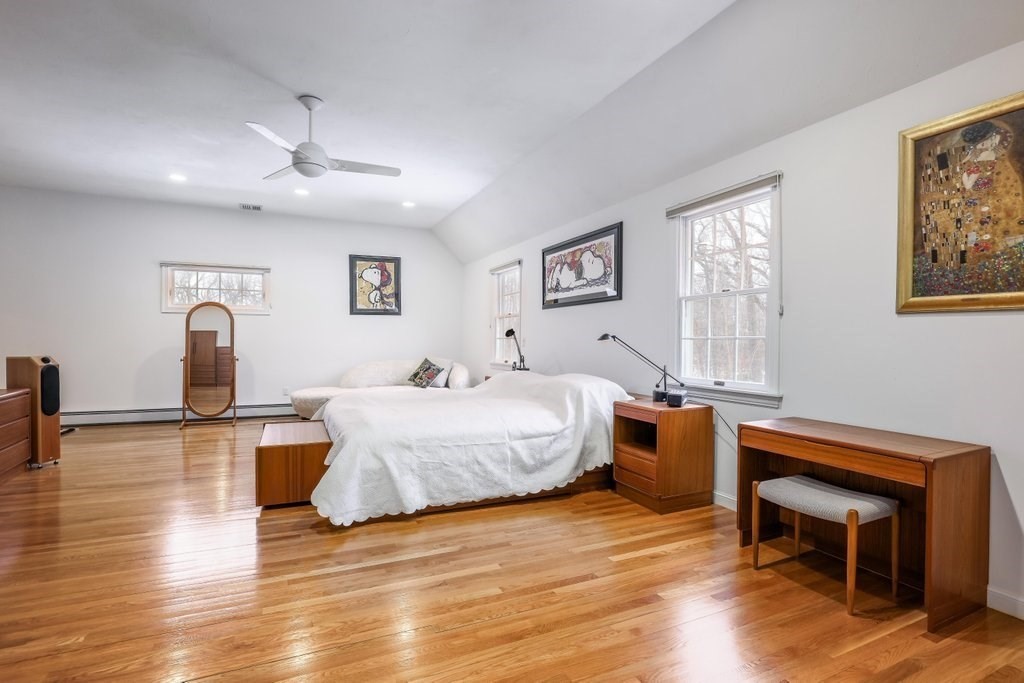 16 Steel Road Hopedale, MA 01747 - Photo 17 of 42 a spacious bedroom with a bed and a table