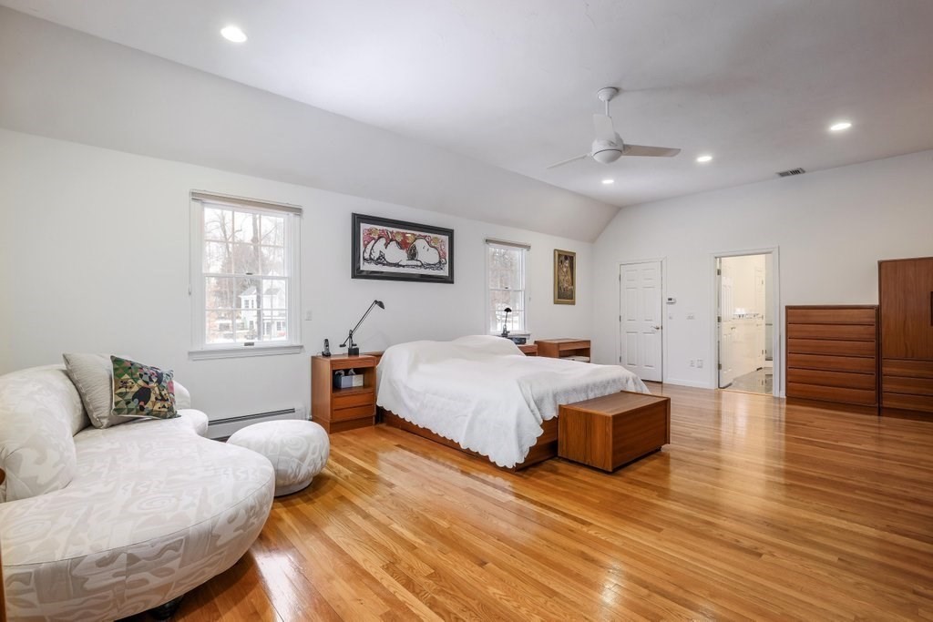 16 Steel Road Hopedale, MA 01747 - Photo 18 of 42 a spacious bedroom with a bed and wooden floor