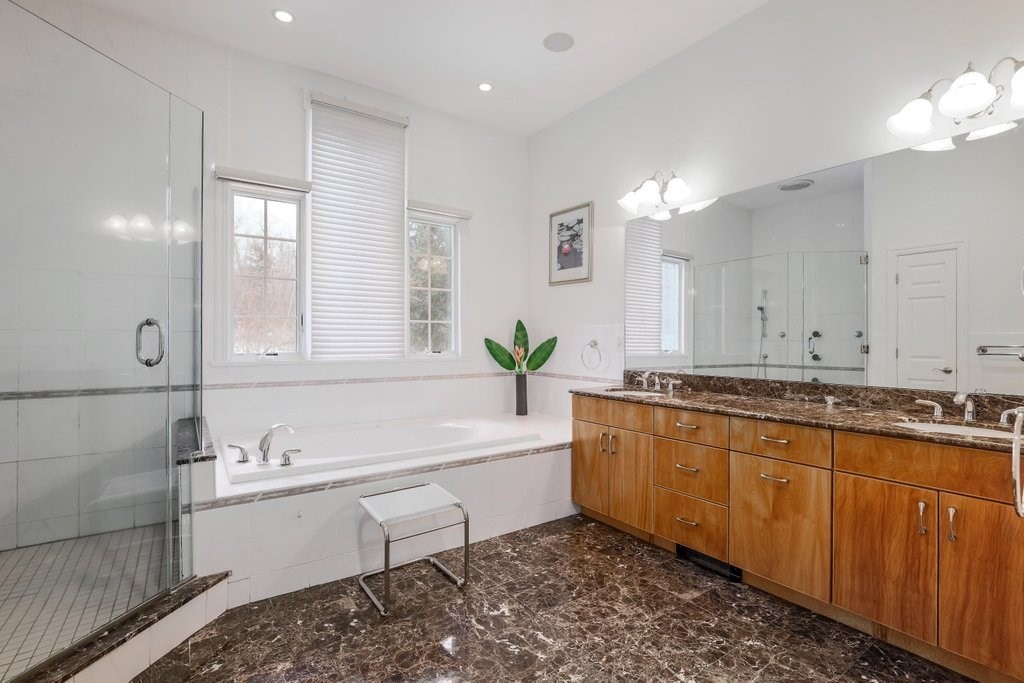 16 Steel Road Hopedale, MA 01747 - Photo 19 of 42 a bathroom with a tub sink and mirror