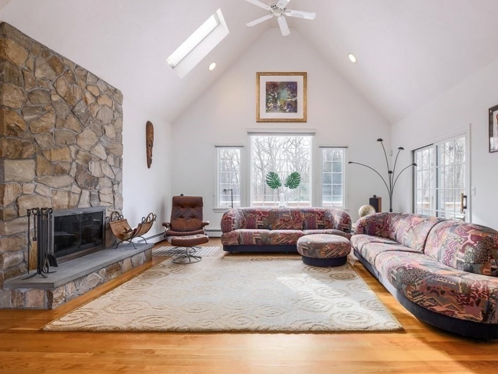 16 Steel Road Hopedale, MA 01747 - Photo 2 of 42 a living room with furniture and a fireplace