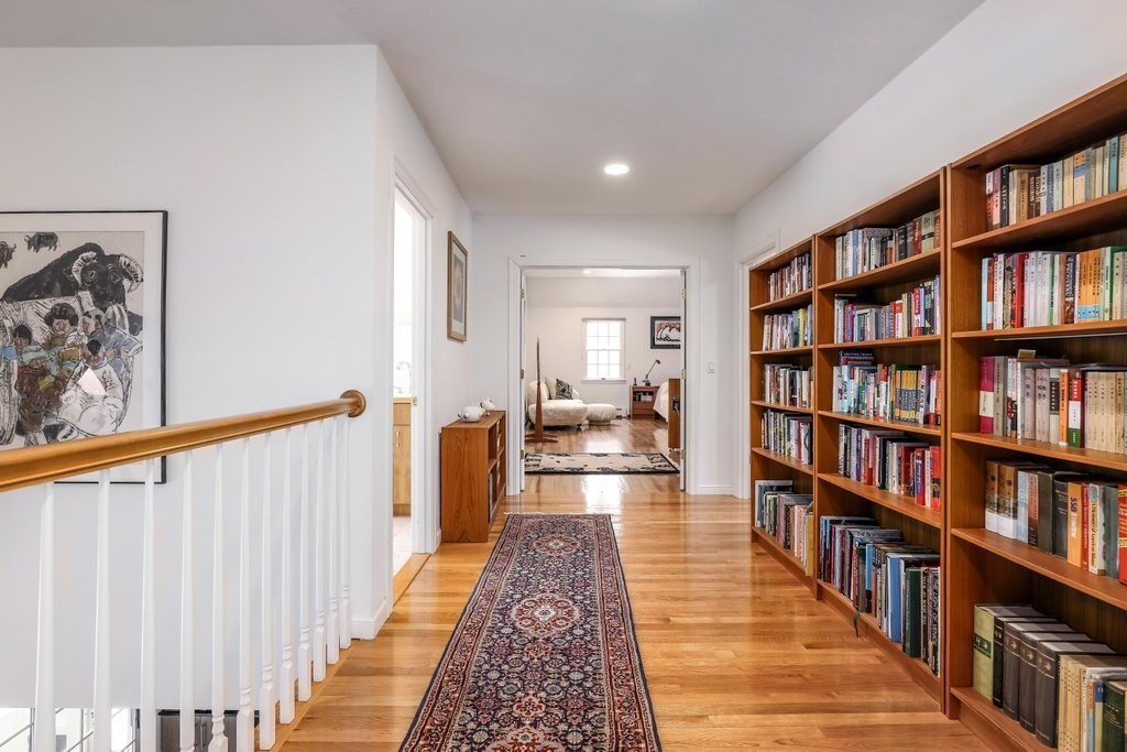 16 Steel Road Hopedale, MA 01747 - Photo 24 of 42 a hallway with a book shelf and a book shelf