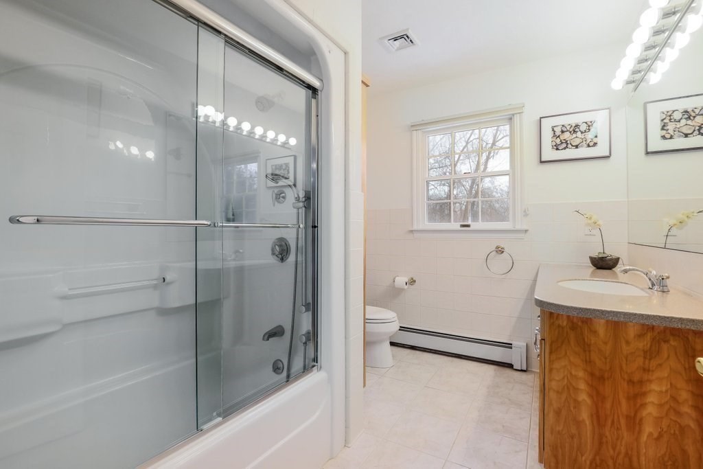 16 Steel Road Hopedale, MA 01747 - Photo 30 of 42 a bathroom with a tub a sink and a shower