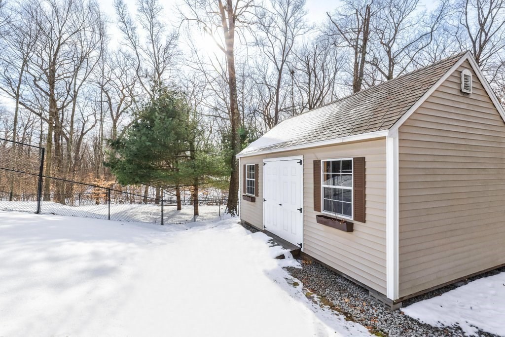 16 Steel Road Hopedale, MA 01747 - Photo 39 of 42 a view of a house with a yard covered in snow