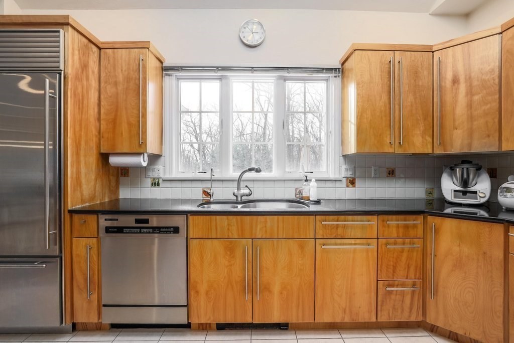 16 Steel Road Hopedale, MA 01747 - Photo 4 of 42 a view of a kitchen with granite countertop stainless steel appliances a sink and a window